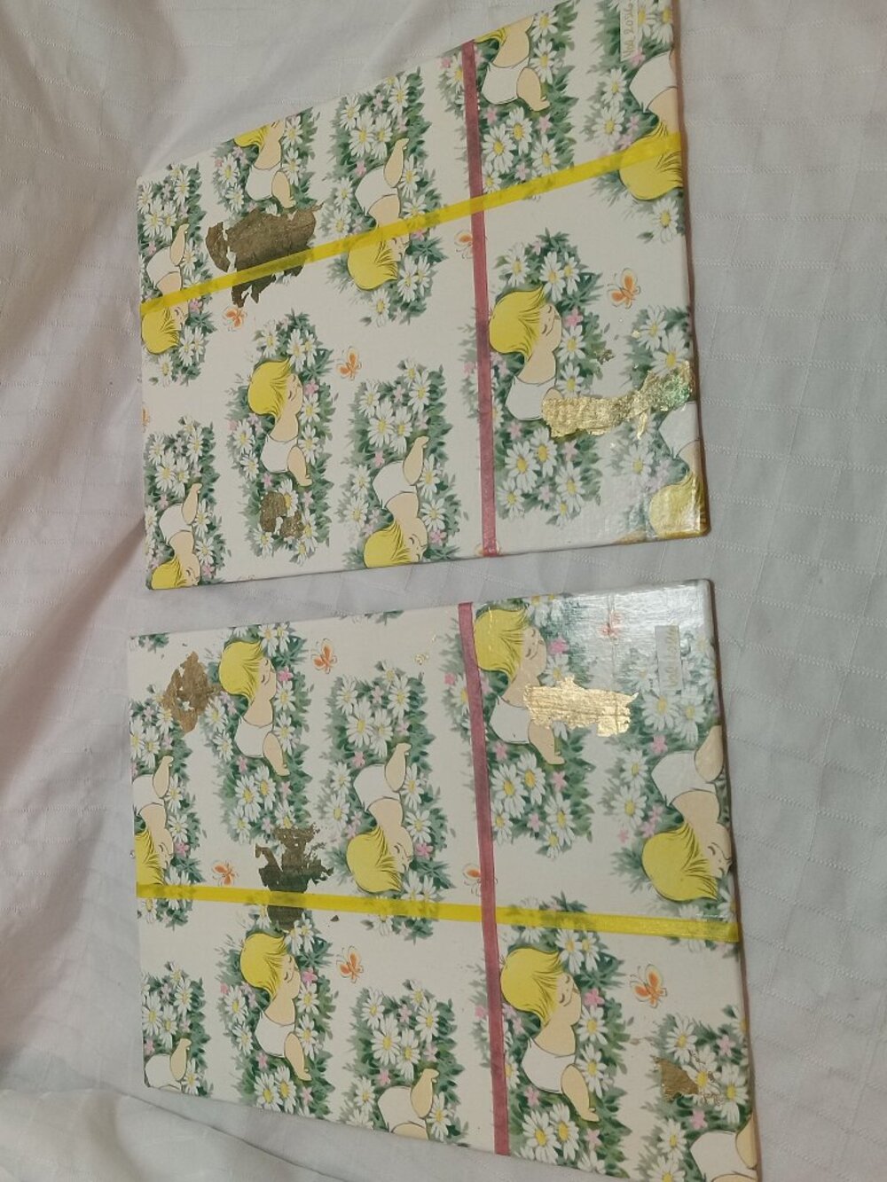 A set of handmade canvas for a baby's room, made of thin vintage wrapping paper